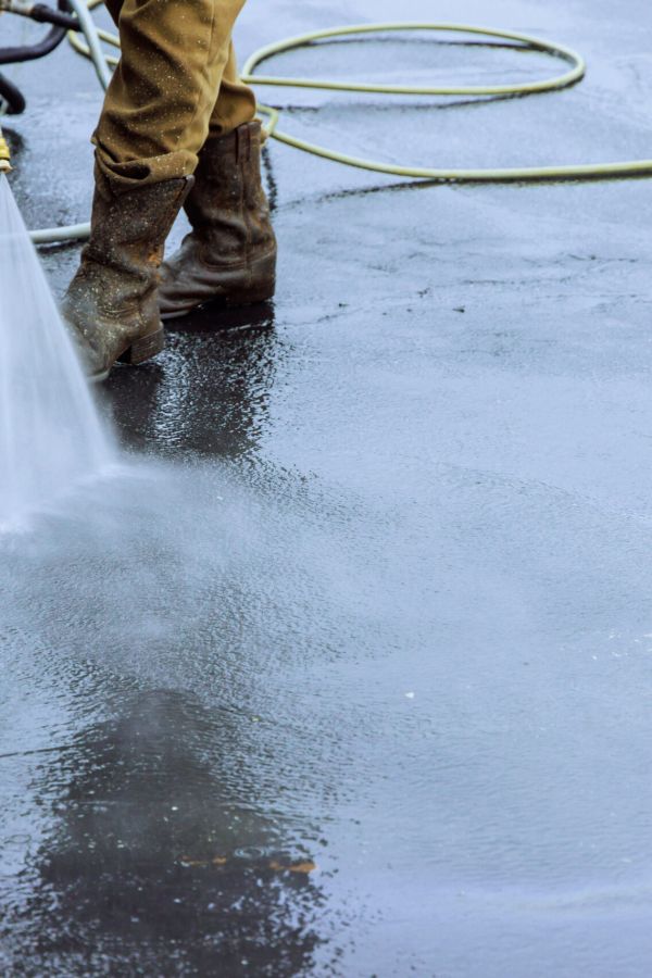 Using Pressurized Water To Clean A Street, Wet Washing Roadway